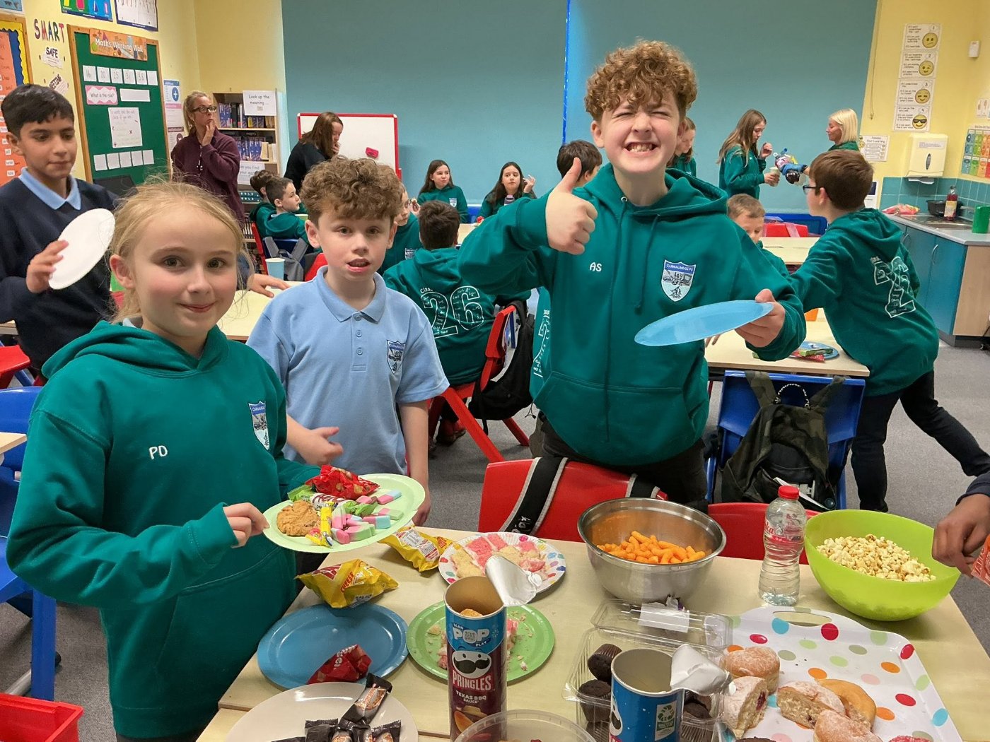 Pupils at Carnalridge Primary School sharing treats together