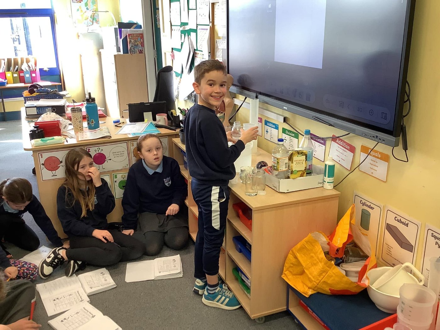 A pupil carrying out a science experiment in class at Carnalridge Primary School